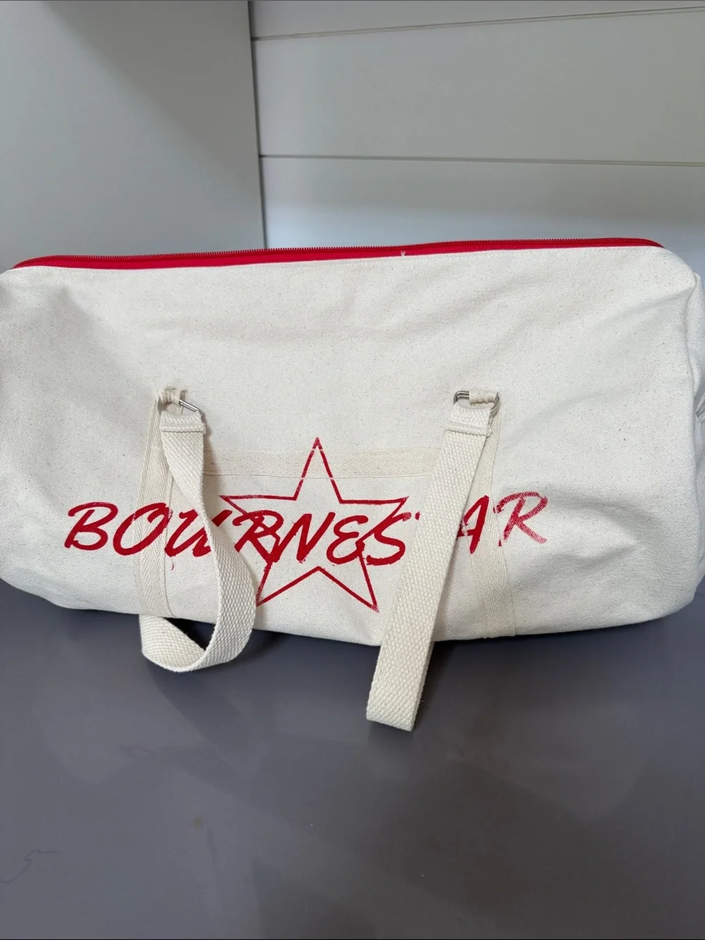 Bourne Star Canvas Duffel Bag in Cream with Red Accents